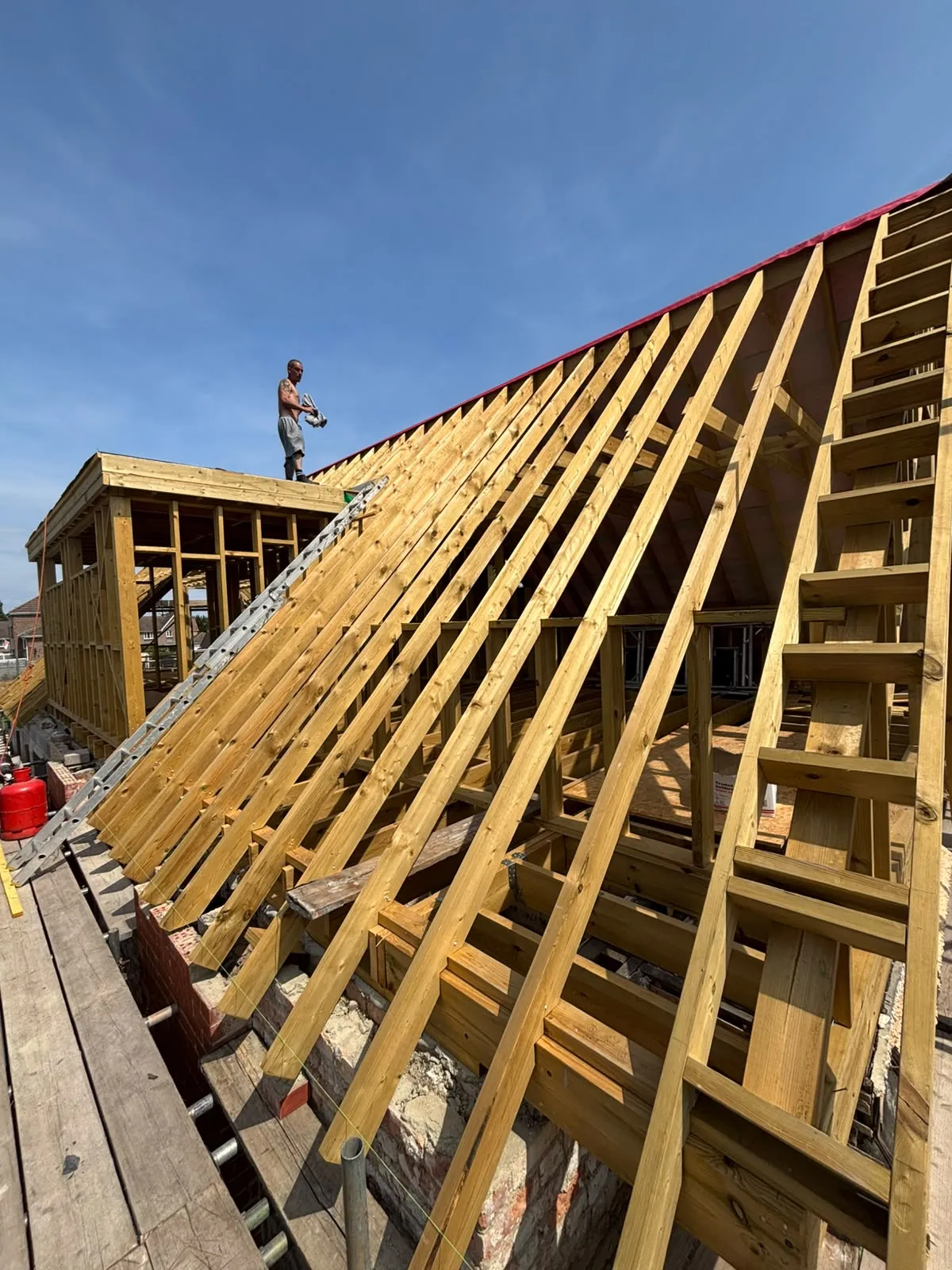 Before: the new roof timbers and dormer frame going up