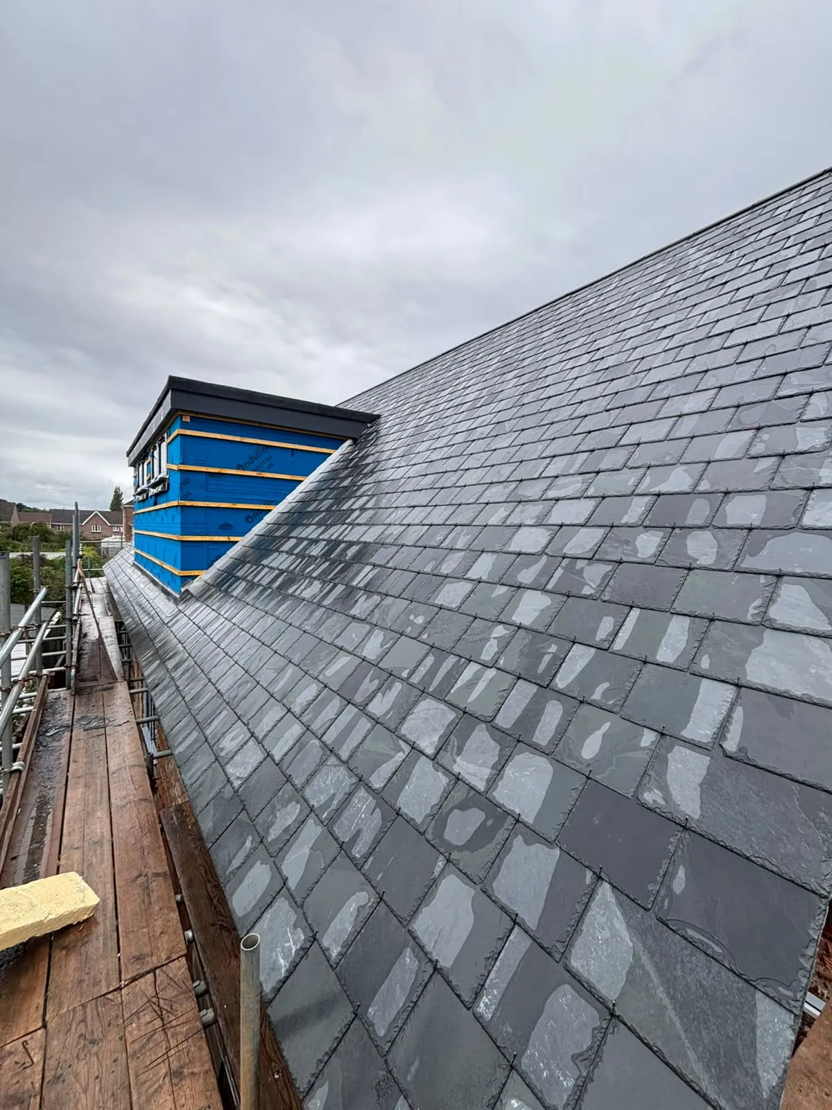 After: the finished natural slate roof and new dormer